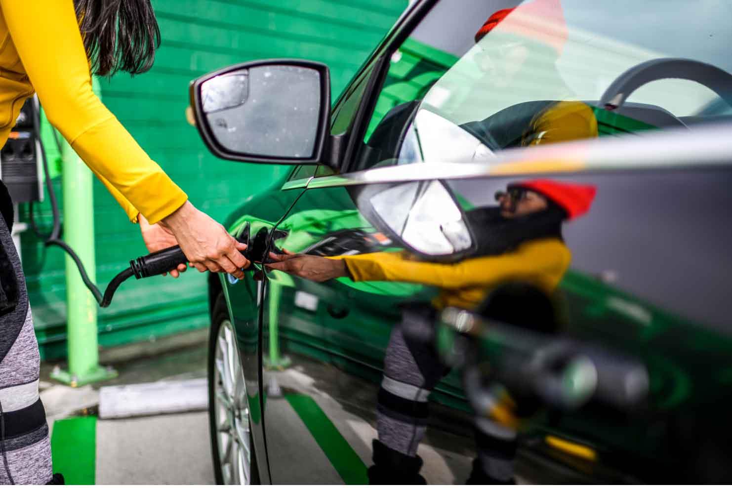 Person filling up tire with air