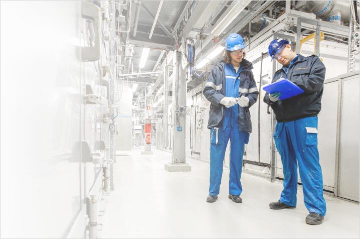 Two employees working in a facility