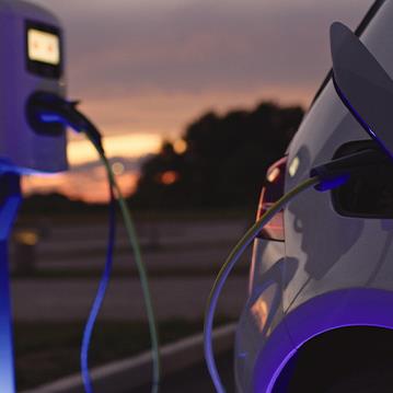 EV car plugged into charging station