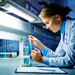 Woman working with pipets on a device