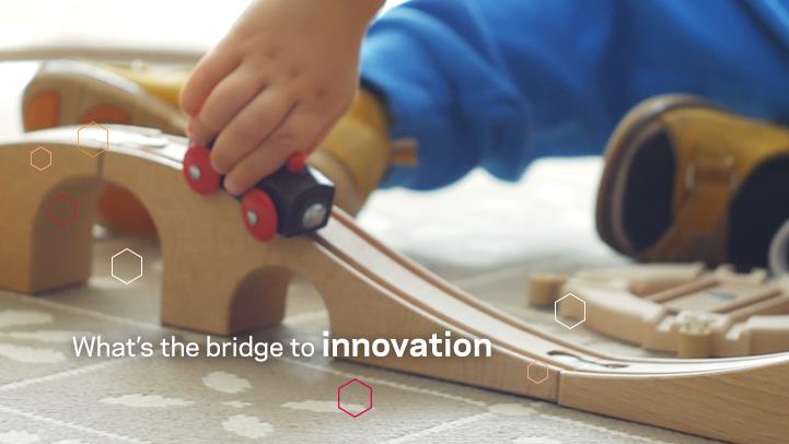 child playing with wooden toy train set