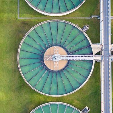 aerial view of round tanks at water treatment plant