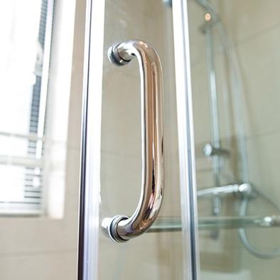 closeup of a clear door to a shower stall