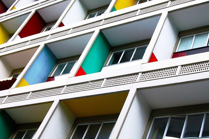 angled shot of multicolored apartment balconies