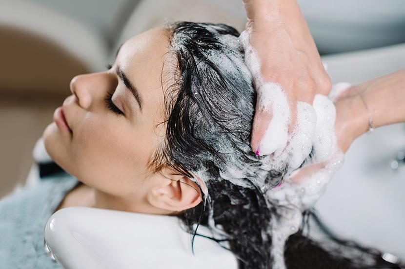 woman at salon getting hair washed