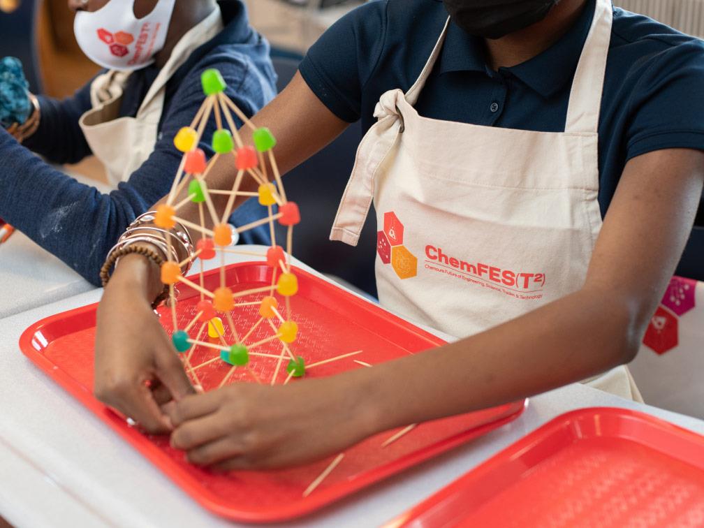 Students building sculpture in ChemFest