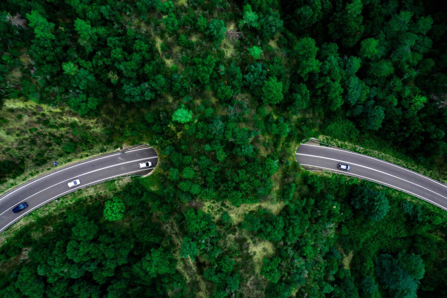 Cars going through a tunnel under a mountain