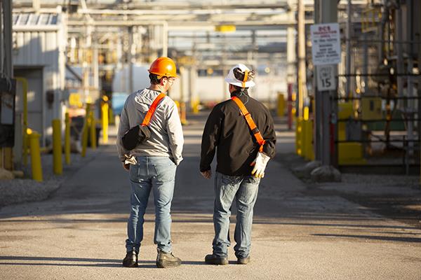 Two employees looking at the facility
