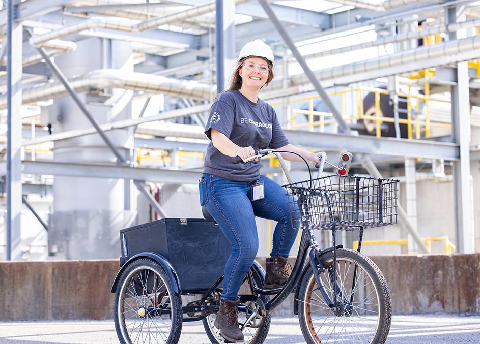 Woman riding a bike next to a facility