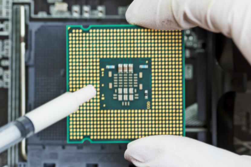 person installing integrated circuit for a cpu