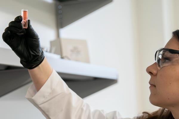 scientist holding up sample