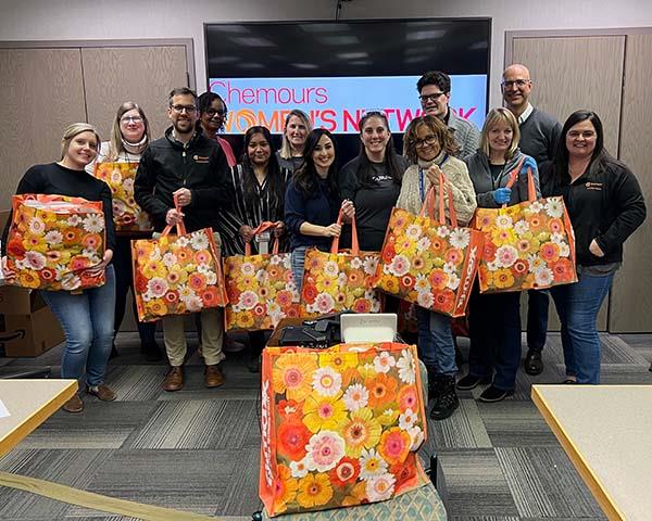 Chemours Womens Network members holding bags