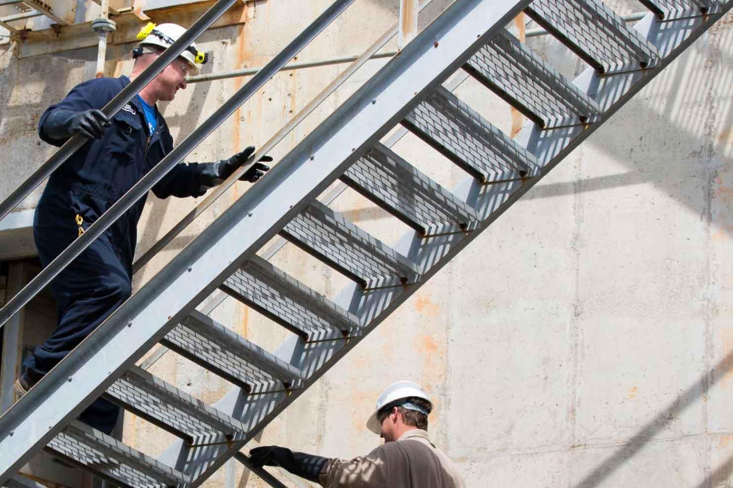 Pair of employees walking up stairs