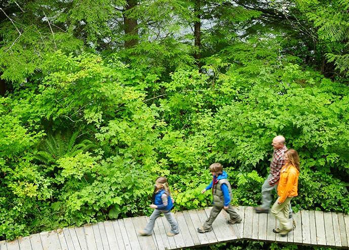 Parents walking down a path with children