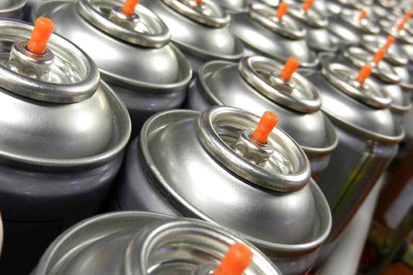 large group of silver aerosol cans