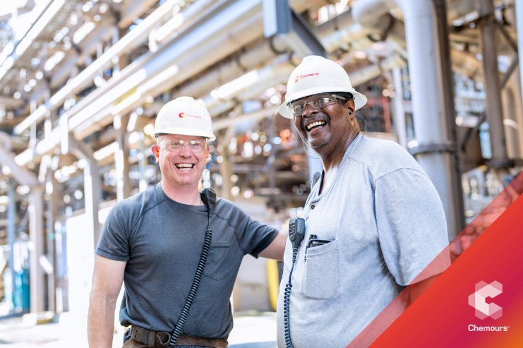 two employees wearing hardhats